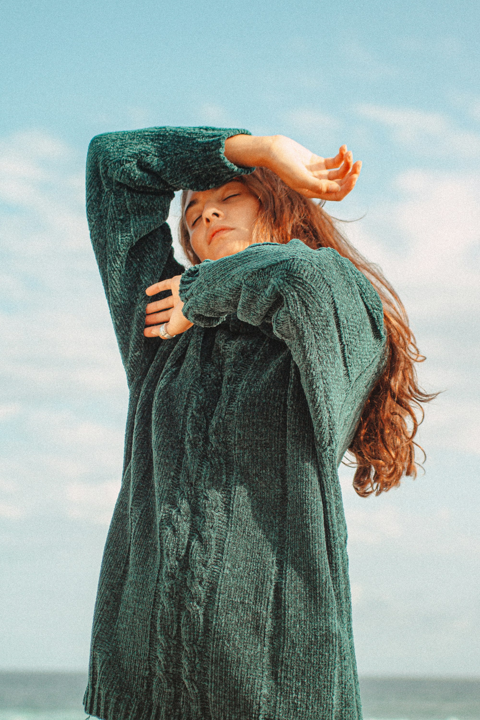Campaign — green knit against the sky